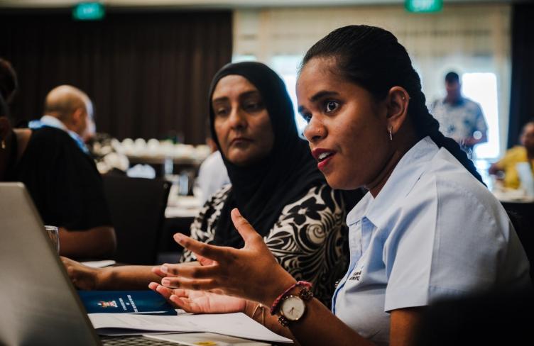Woman participant talks at the Fiji national dialogue